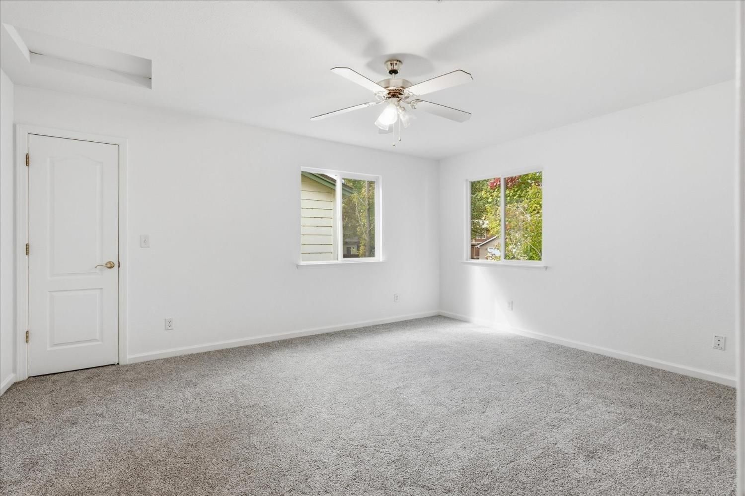 Before: empty bedroom with two windows