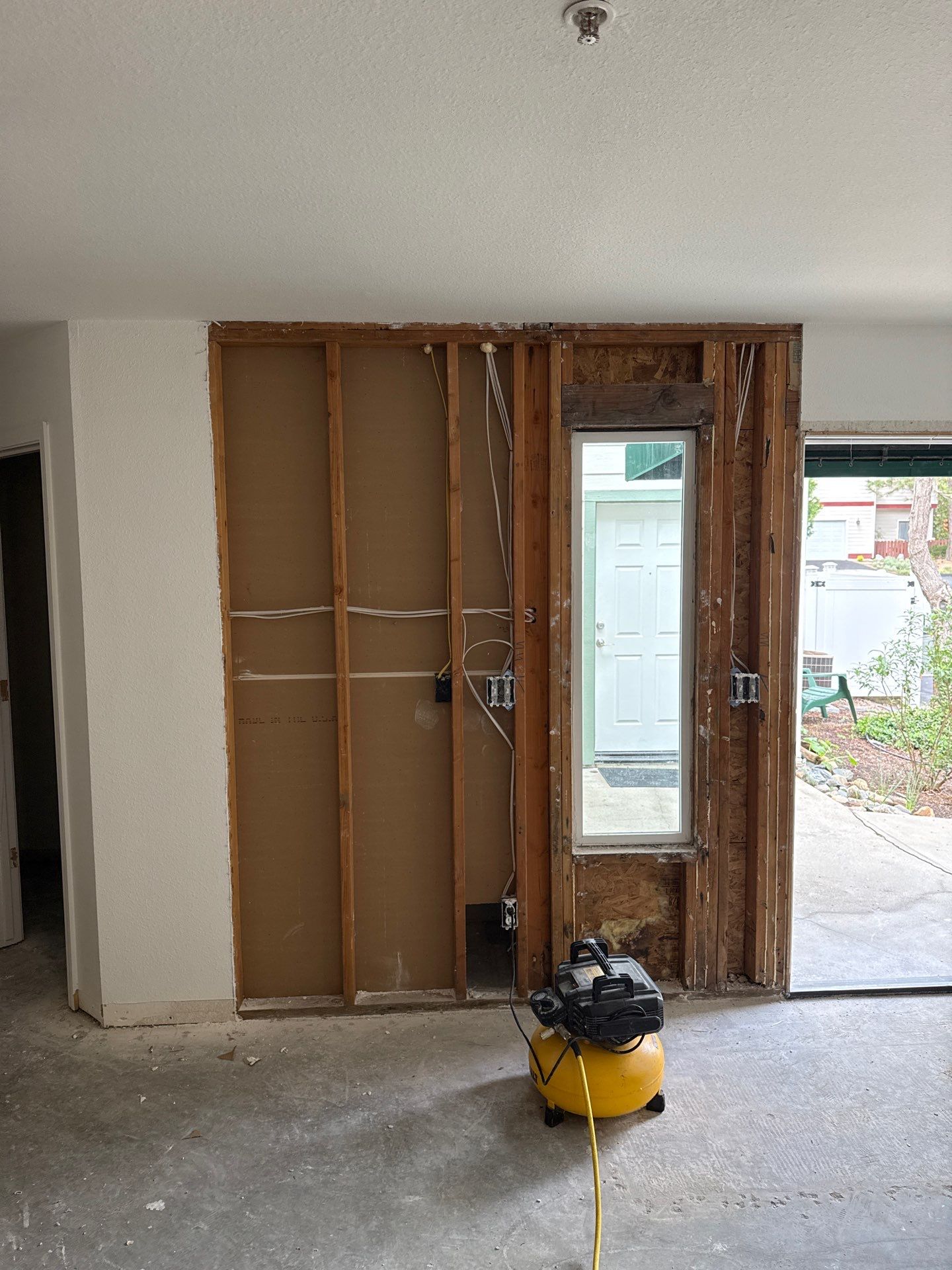 Construction: open wall where the front door is visible