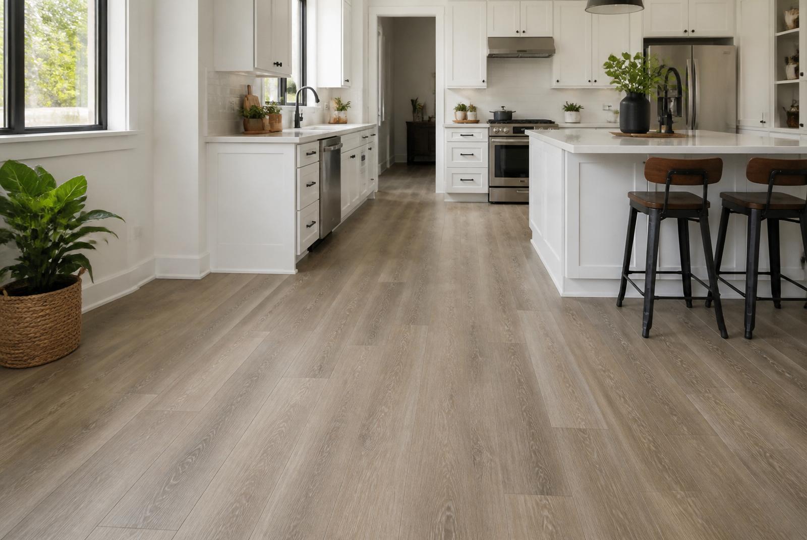 Warm gray oak luxury vinyl plank installed in a bright white kitchen